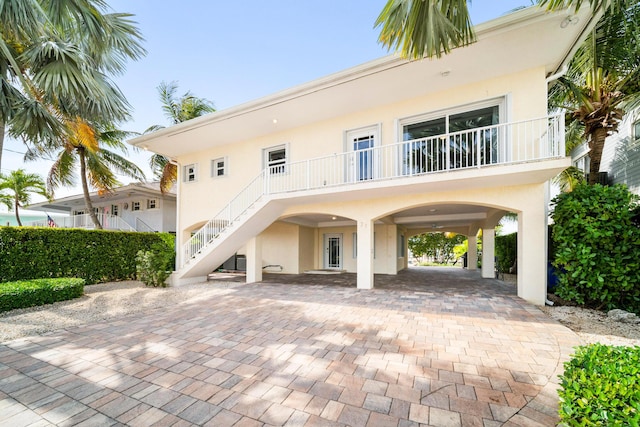 rear view of property featuring a carport