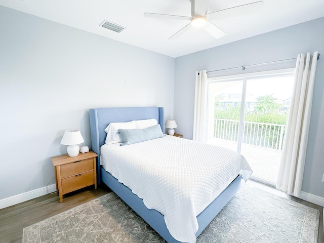 bedroom with access to outside, dark hardwood / wood-style floors, and ceiling fan