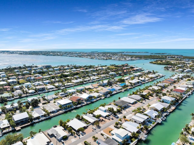 drone / aerial view featuring a residential view and a water view