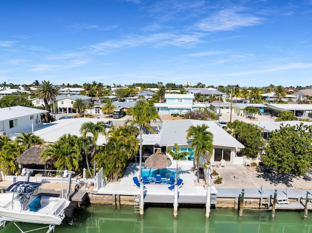 aerial view with a water view and a residential view