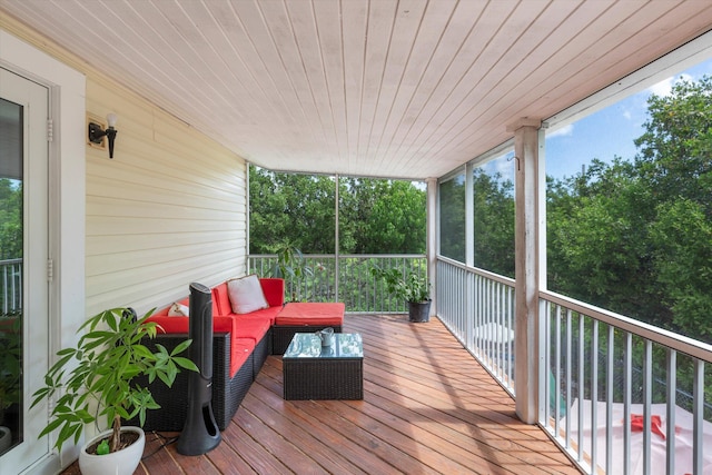 wooden terrace featuring an outdoor hangout area