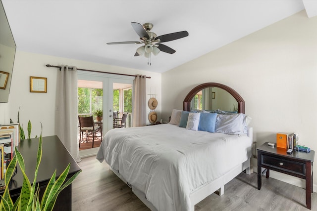 bedroom with lofted ceiling, light hardwood / wood-style flooring, ceiling fan, access to exterior, and french doors