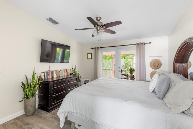 bedroom with lofted ceiling, light hardwood / wood-style flooring, ceiling fan, access to exterior, and french doors