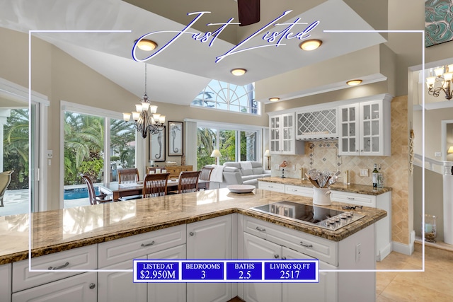 kitchen with white cabinetry and a notable chandelier