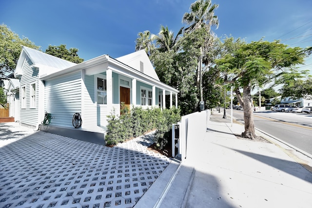 view of home's exterior featuring fence