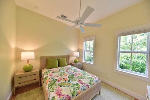 bedroom featuring baseboards, visible vents, and ceiling fan
