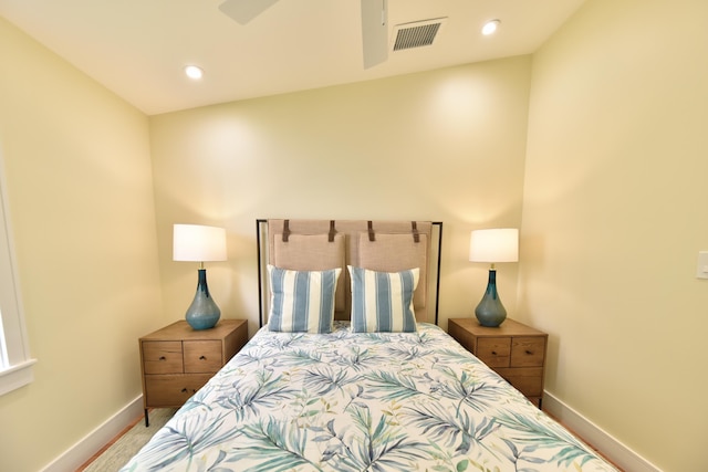 carpeted bedroom with baseboards, recessed lighting, and visible vents