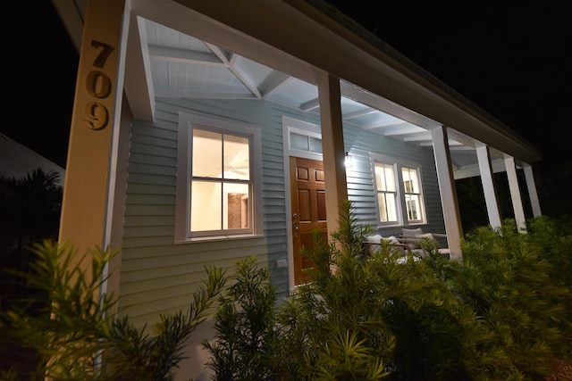 view of property exterior at night