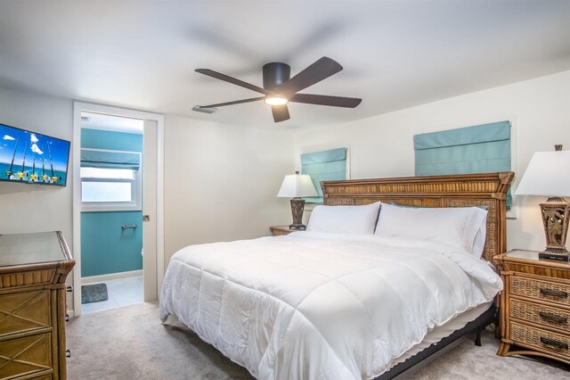 bedroom featuring ceiling fan and carpet