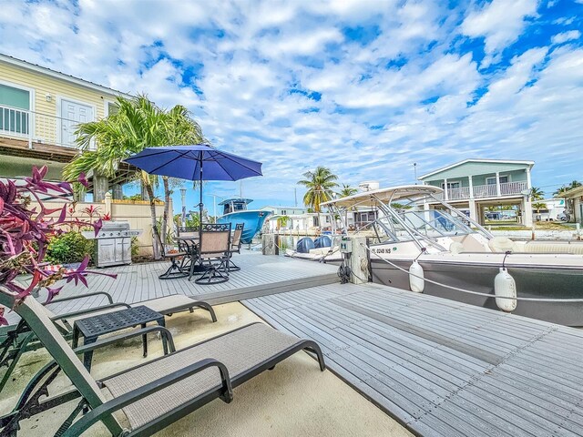 wooden terrace with area for grilling