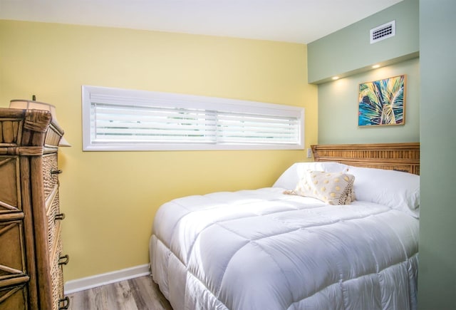 bedroom with light hardwood / wood-style flooring