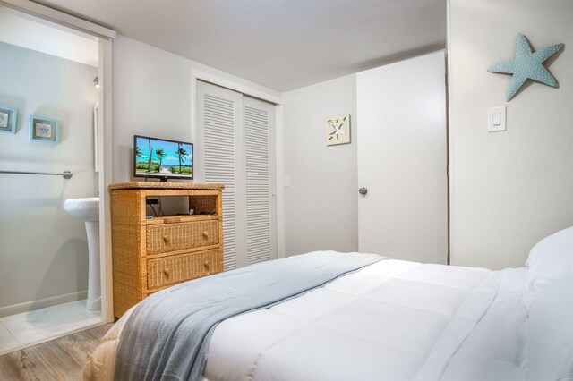 bedroom featuring hardwood / wood-style flooring and a closet