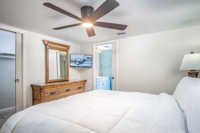 bedroom featuring ceiling fan, connected bathroom, and carpet