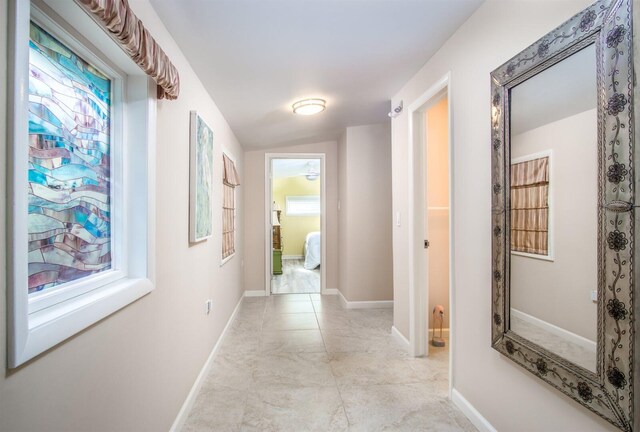 hallway featuring a wealth of natural light