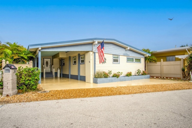 view of front of home featuring a carport