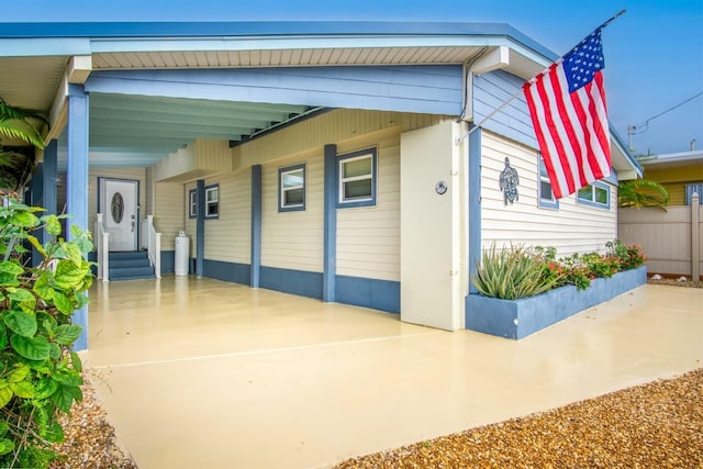 exterior space featuring a carport