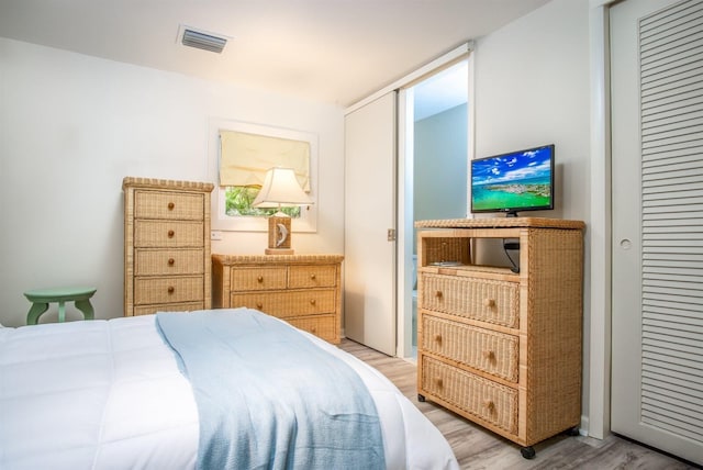 bedroom featuring light hardwood / wood-style floors