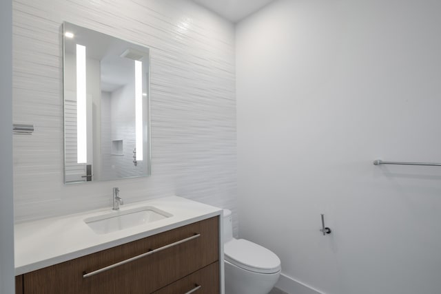 1614 Washington St, Key West, FL 33040 - half bathroom featuring vanity, toilet, and tile walls
