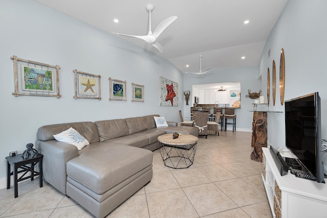 tiled living room featuring lofted ceiling and ceiling fan