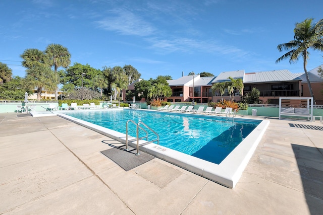 view of swimming pool with a patio area