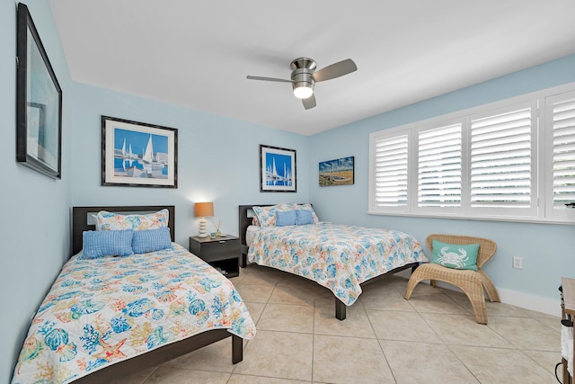 tiled bedroom with ceiling fan