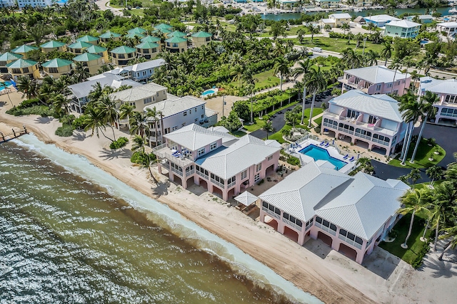 bird's eye view with a water view and a residential view