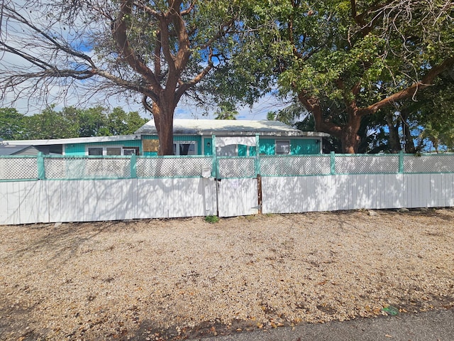 view of swimming pool with a fenced front yard