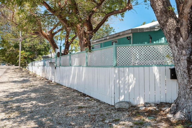 view of home's exterior featuring fence