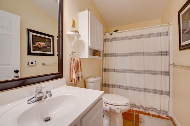 full bath featuring a shower with shower curtain, toilet, tile patterned floors, vaulted ceiling, and vanity