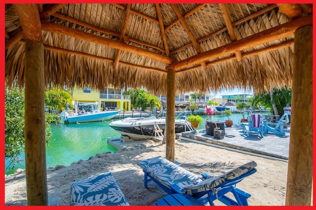 view of patio / terrace with a water view and a gazebo