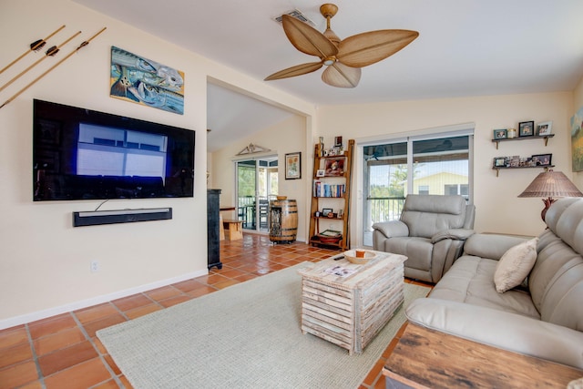 tiled living area with vaulted ceiling, baseboards, and ceiling fan