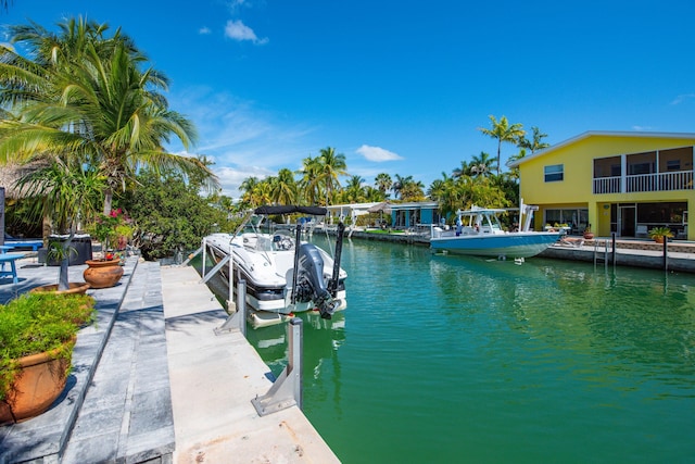 view of dock with a water view and boat lift