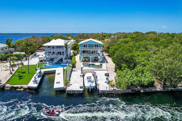 birds eye view of property with a water view