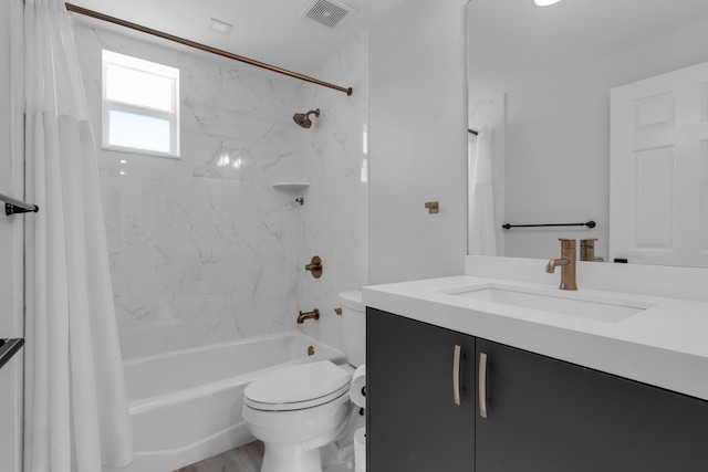 full bathroom featuring shower / tub combo with curtain, vanity, and toilet