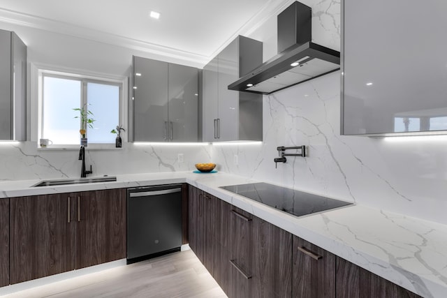 kitchen featuring extractor fan, sink, dishwashing machine, black electric stovetop, and light stone counters