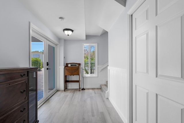 hall with light hardwood / wood-style floors