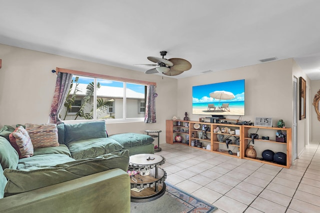 living room with light tile patterned floors and ceiling fan