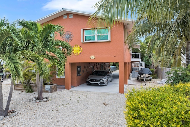 rear view of house with a carport