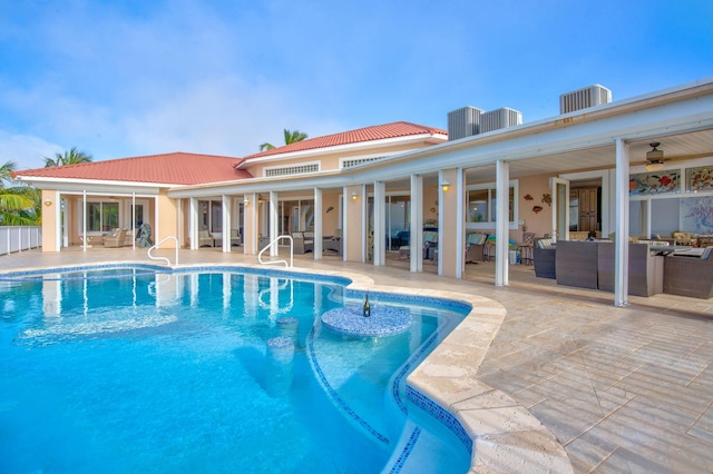 view of swimming pool with an outdoor living space, a patio, cooling unit, and ceiling fan