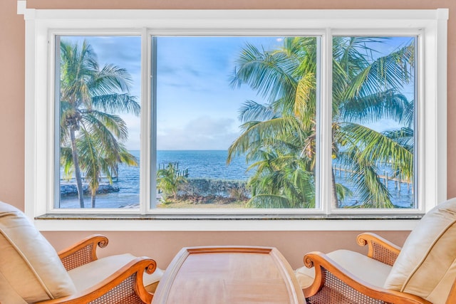 living area featuring a water view