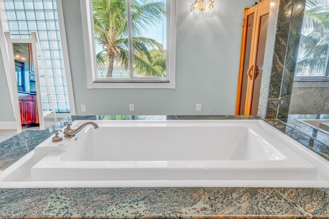 bathroom with tiled bath