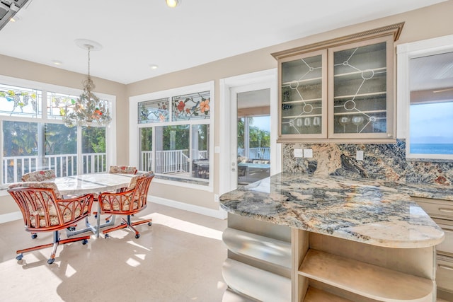 dining area with a notable chandelier and breakfast area