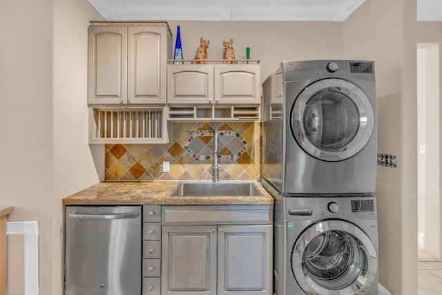 laundry area with stacked washing maching and dryer, sink, and ornamental molding