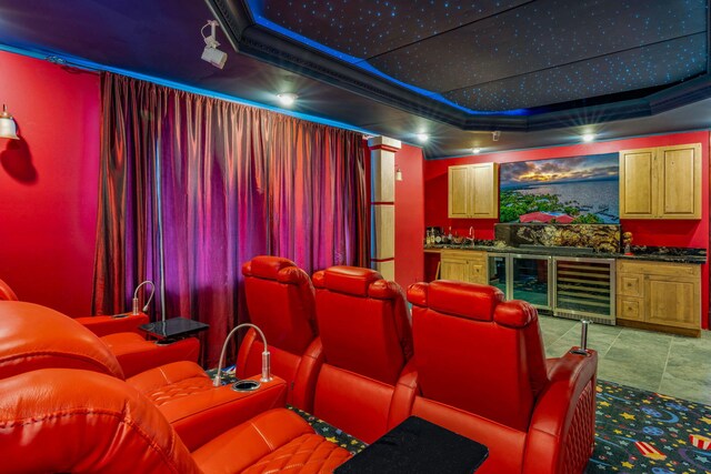 cinema with wine cooler, indoor bar, and a raised ceiling