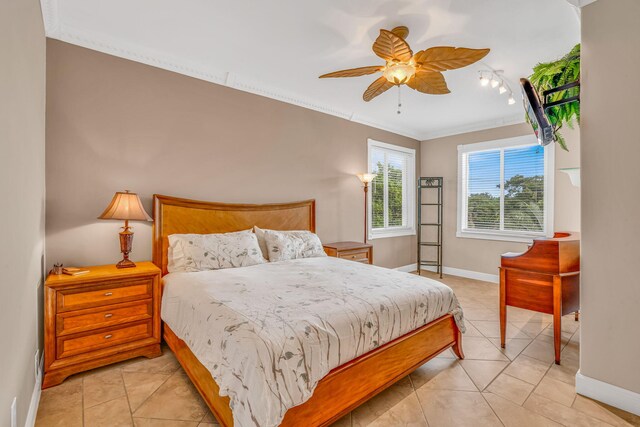 bedroom featuring crown molding, light tile patterned floors, and ceiling fan