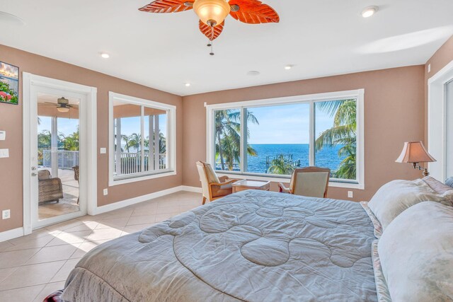 bedroom featuring light tile patterned flooring, a water view, access to outside, and ceiling fan