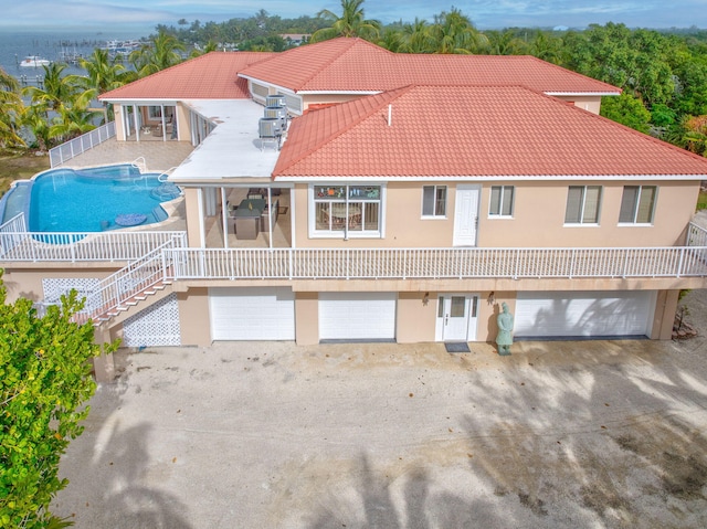 back of property with a garage