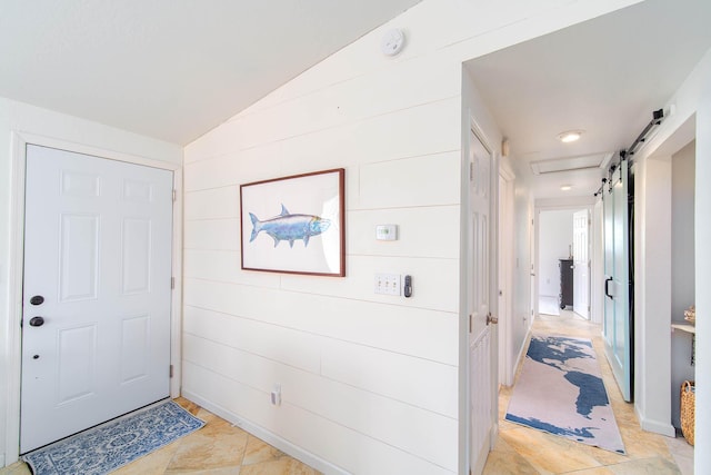 22988 Port Royal Ln, Cudjoe, FL 33042 - foyer entrance with vaulted ceiling and a barn door