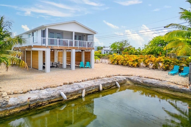 22988 Port Royal Ln, Cudjoe, FL 33042 - back of house featuring a patio and a balcony