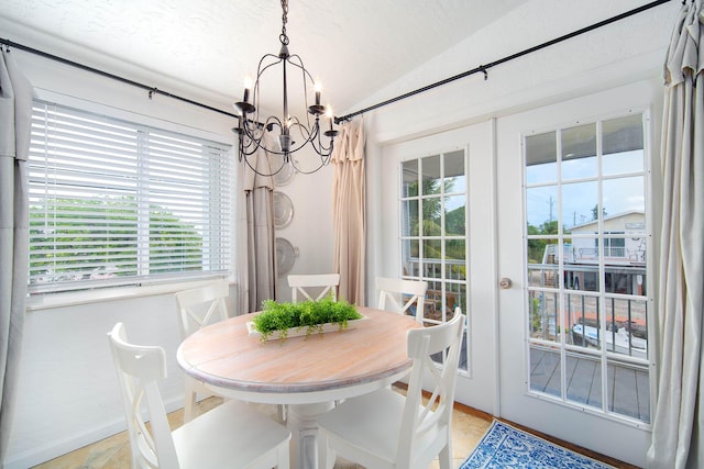 22988 Port Royal Ln, Cudjoe, FL 33042 - dining area with a chandelier, lofted ceiling, and french doors